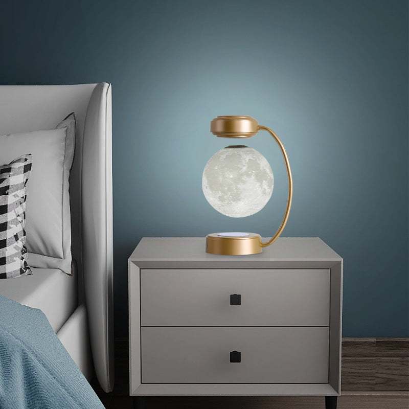 Modern night lamp featuring a moon design, perfect for enhancing bedroom decor with soft lighting.