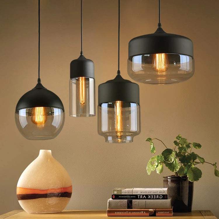 Stylish hanging lamps in various designs with warm light creating a cozy atmosphere. Lamp collection.