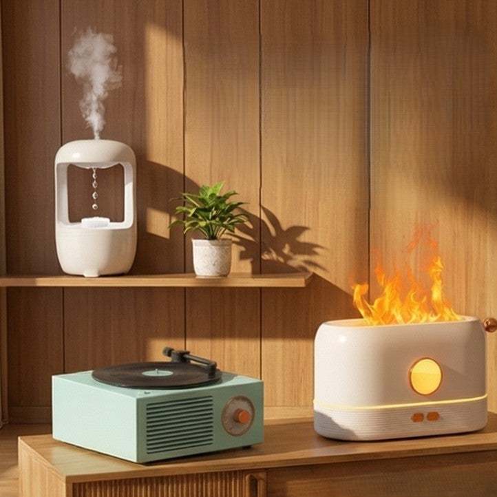 Stylish accessories including a record player, humidifier, and decorative fire heater in modern interior.